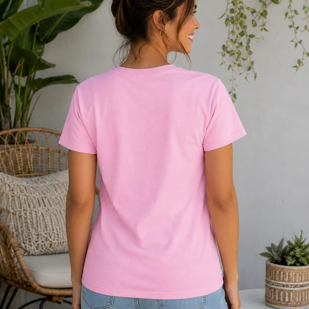 Back view mockup of Womens' Ultra Cotton T-Shirt - Gildan Light Pink worn by woman in lifestyle setting