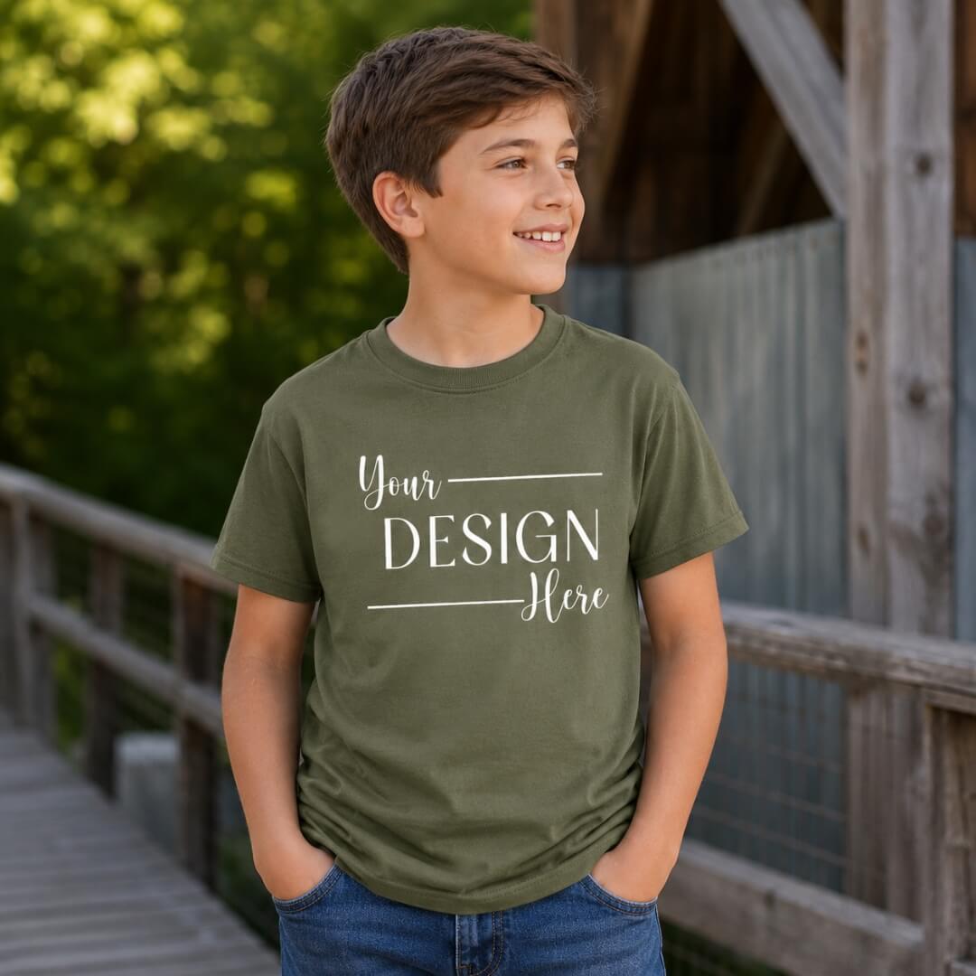 Youth model wearing Gildan Youth Softstyle T-Shirt in Military Green lifestyle mockup