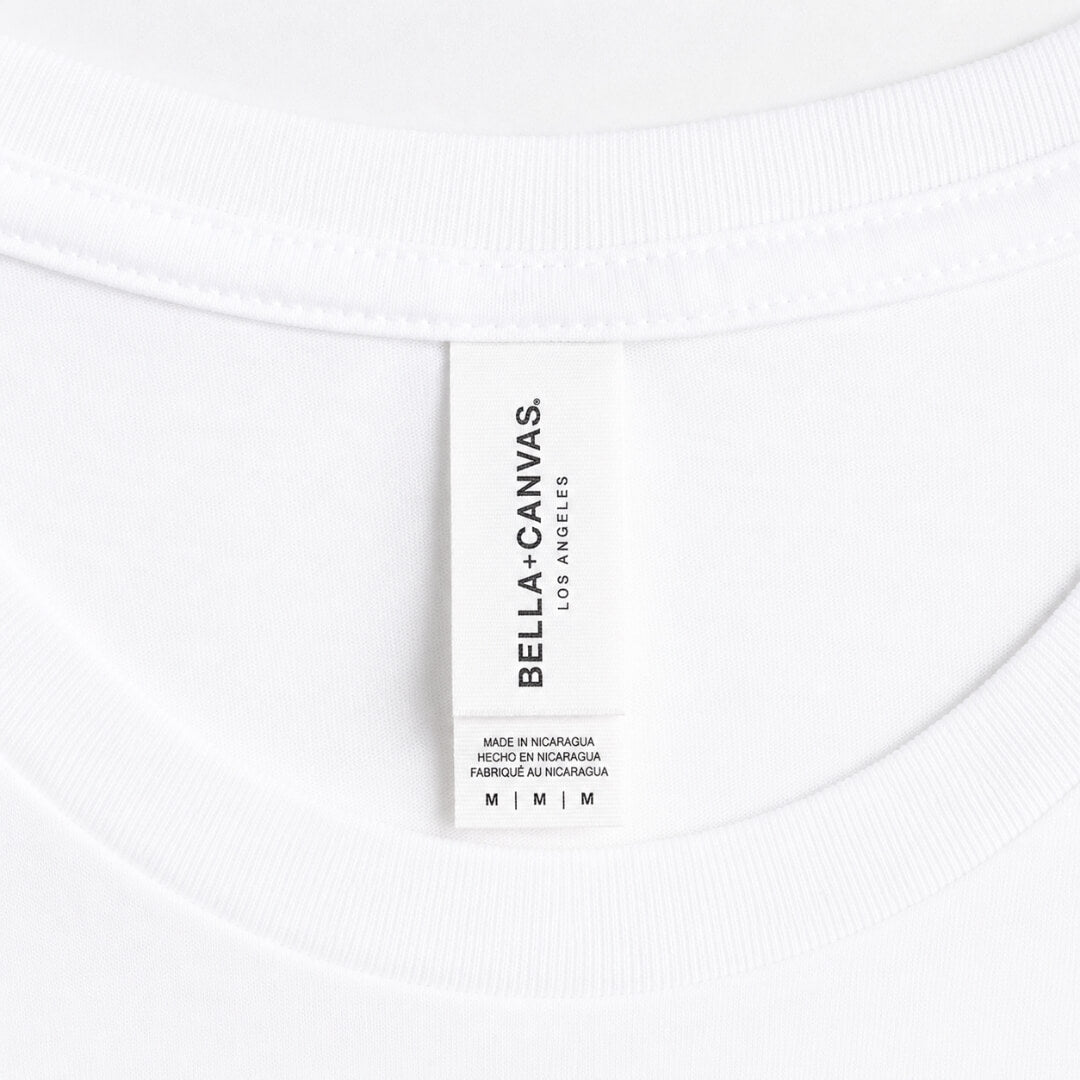 Close-up of Bella + Canvas Jersey T-Shirt Unisex tag and fabric detail in White