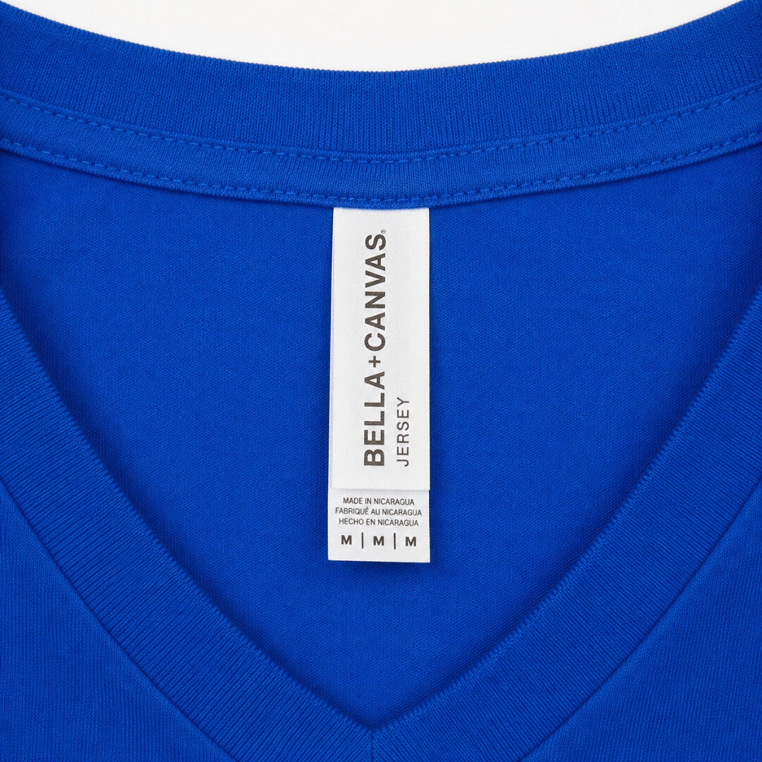 Close-up of Bella + Canvas Jersey Short-Sleeve V-Neck T-Shirt Unisex tag and fabric detail in True Royal