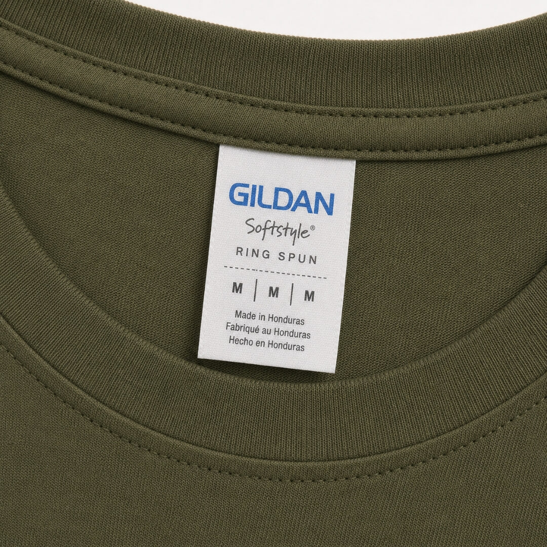 Close-up of Gildan Youth Softstyle T-Shirt tag and fabric detail in Military Green